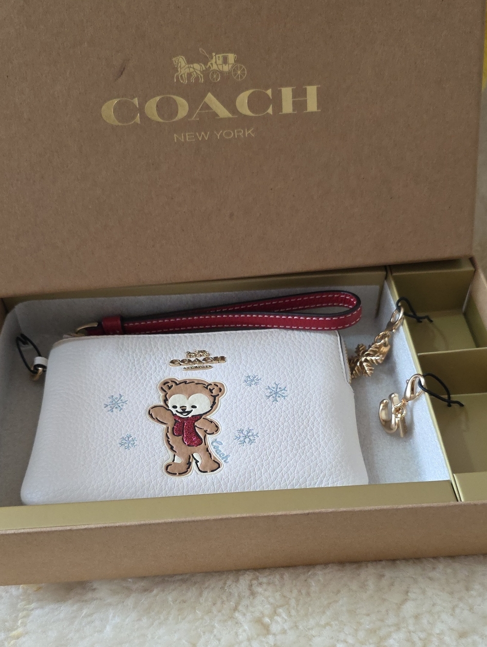Coach White Leather Wristlet with Bear Appliqué and Red Strap